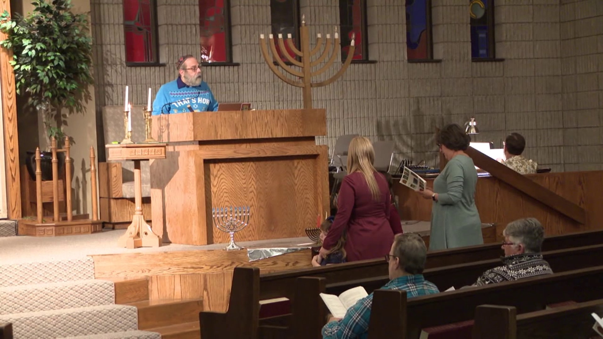 Friday night's Hanukkah celebration at Temple Hesed saw more than a dozen congregation members come together in an area where they can all feel safe.