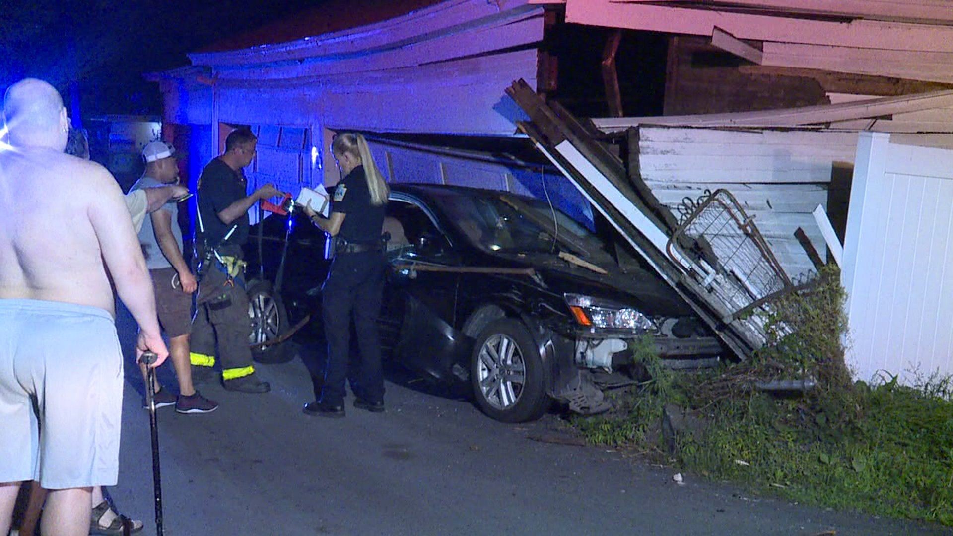 Car Crashes into Fence, Garage in Scranton