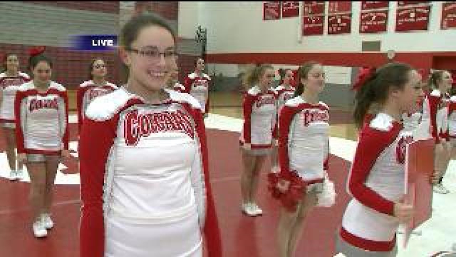 Cheerleaders Prep Stunts for Competition