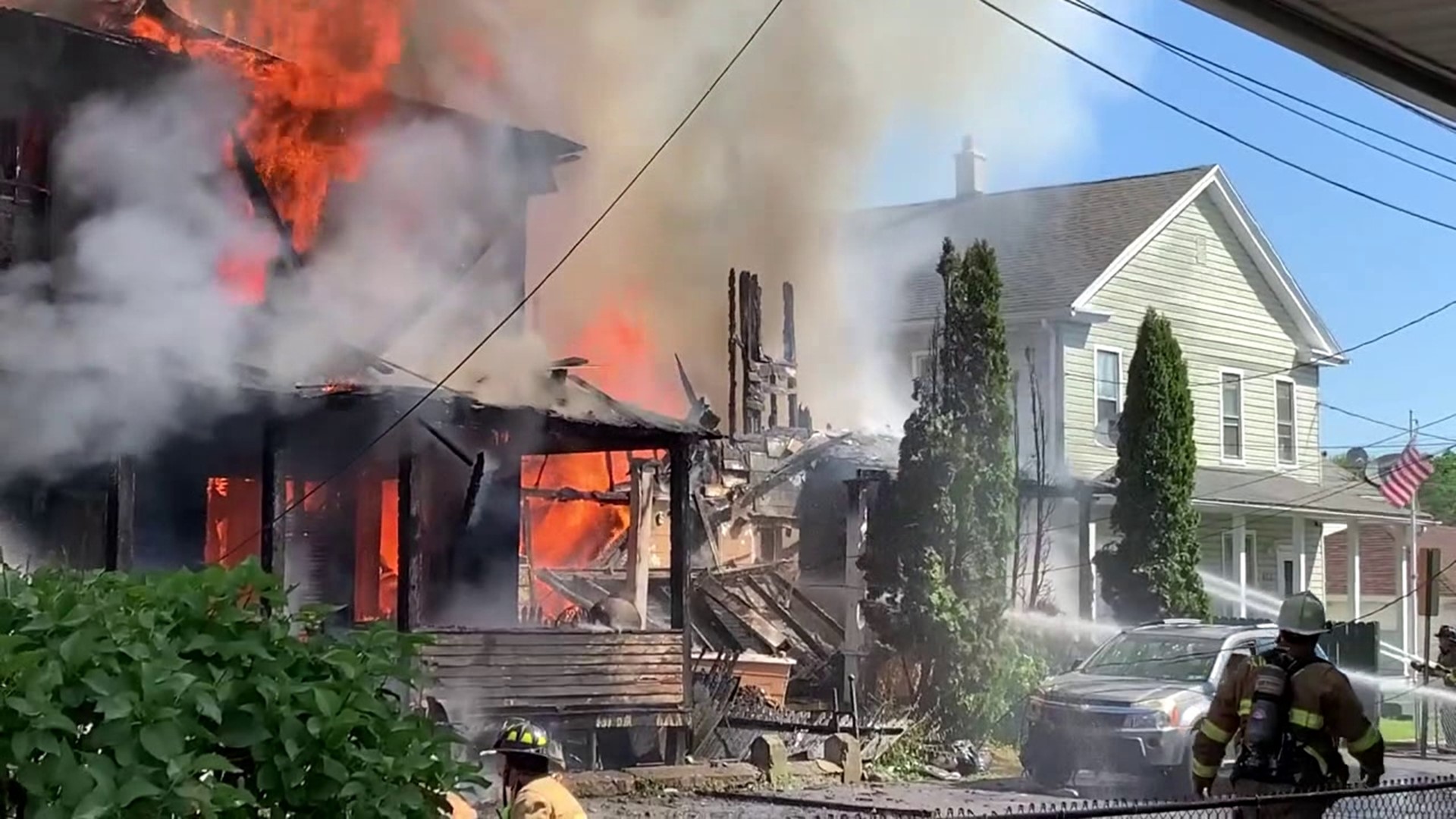 A massive fire tore through several homes in Plymouth Saturday morning leaving one person dead.