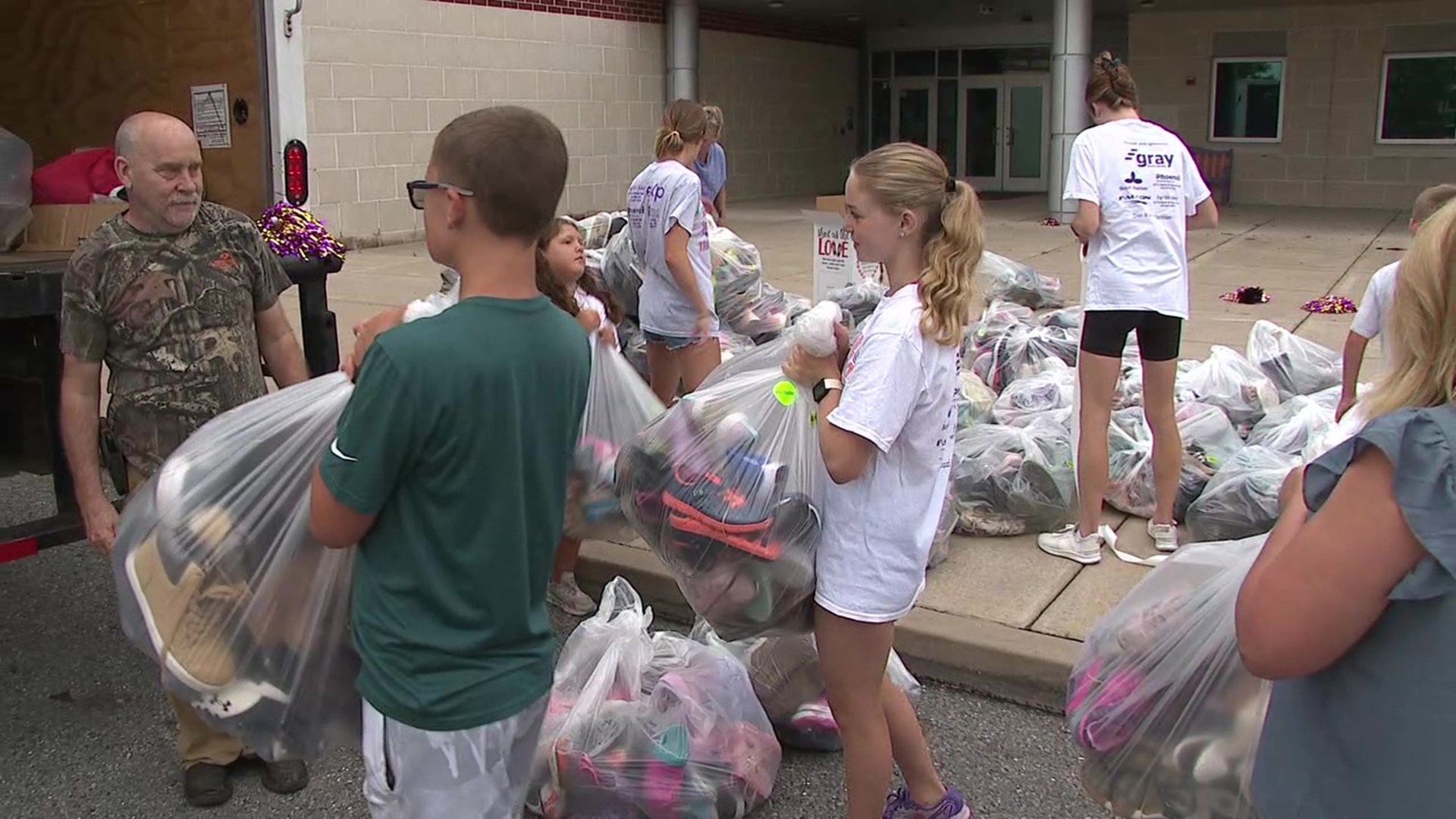 Some elementary school students in Danville raised money for their school's running club by collecting shoes for people in other countries.