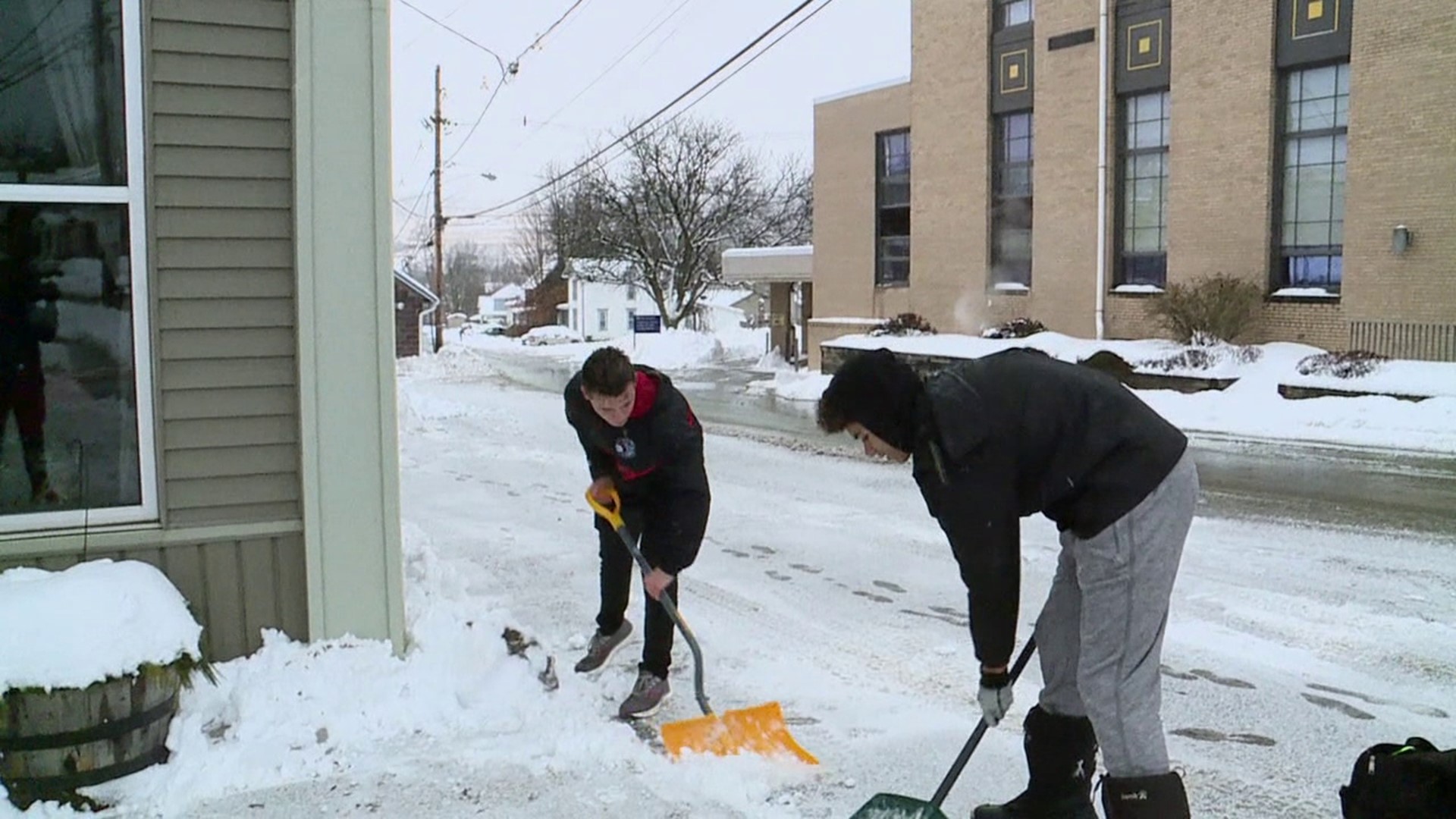 People spent their day clearing up the more than eight inches of snow in Canton.