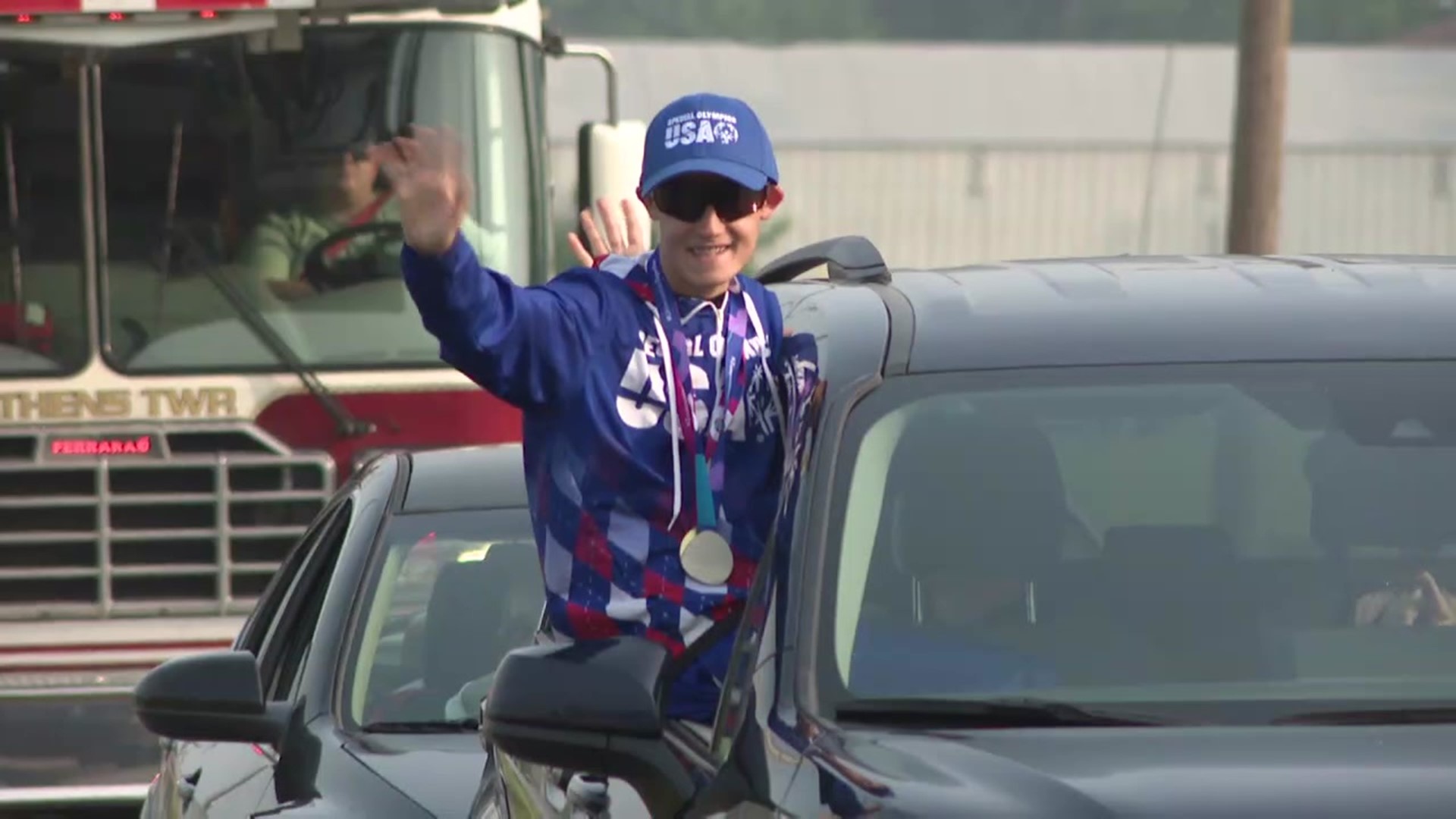 Izaak Hobday was paraded through the streets of his hometown after winning gold and silver medals.