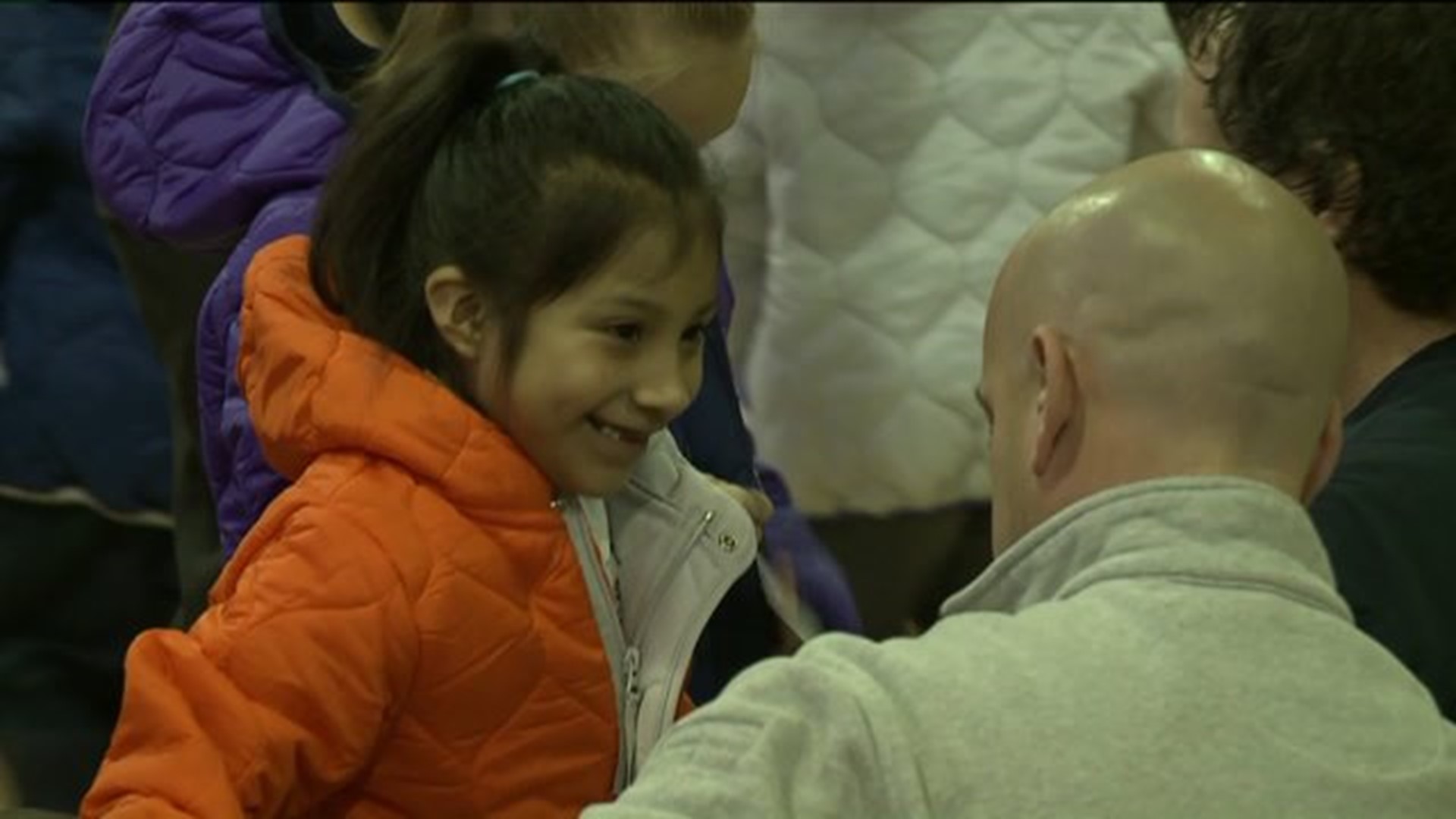 Firefighters Give Gifts of Warmth to Elementary Students