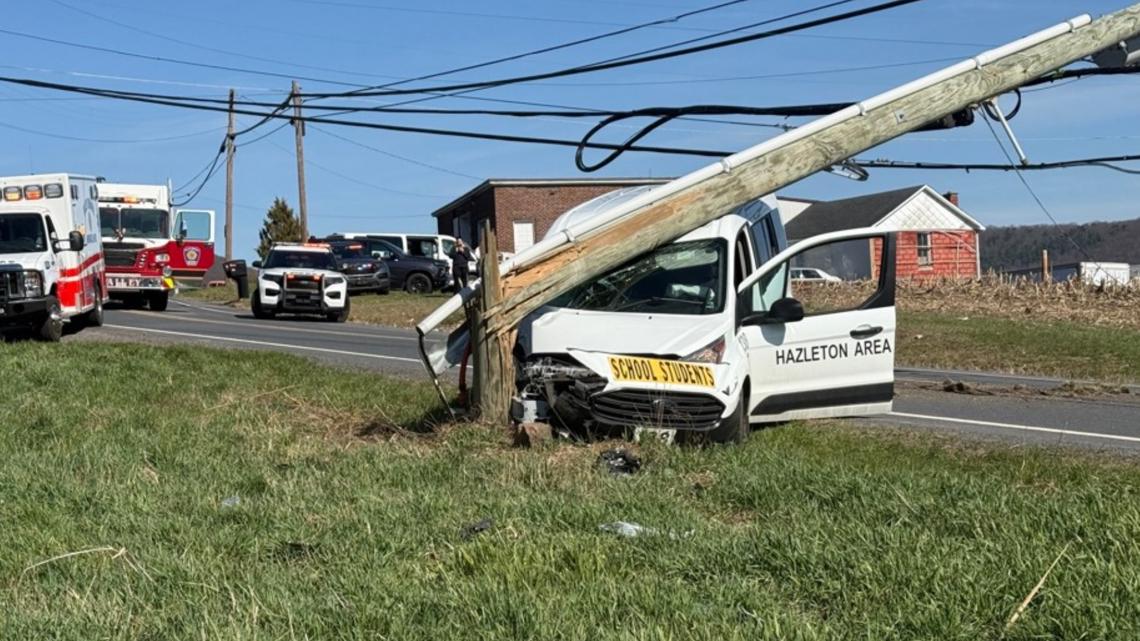 School van crashes into utility pole, prompting outages and road ...