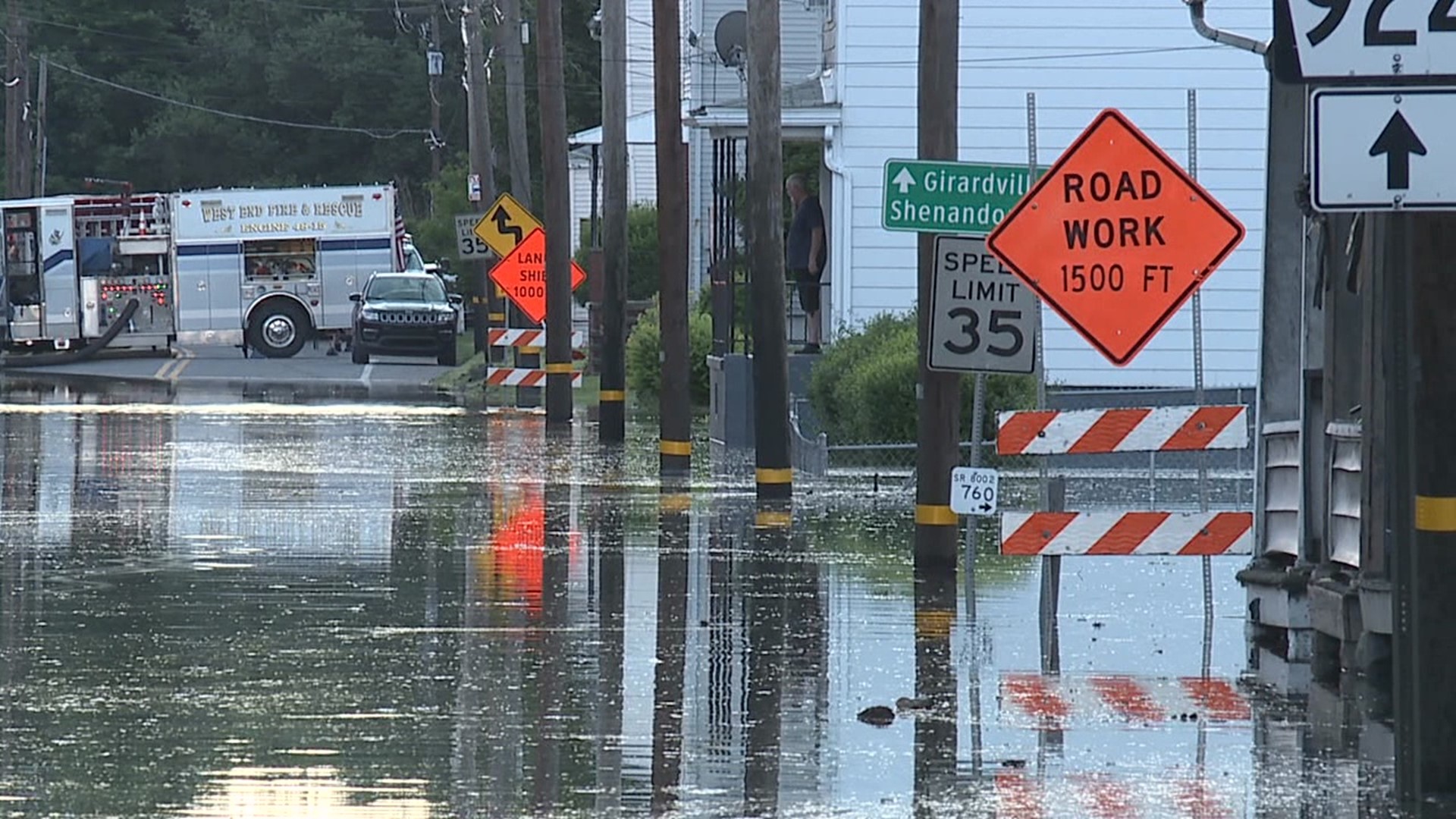 Flooding leaves properties and vehicles submerged.