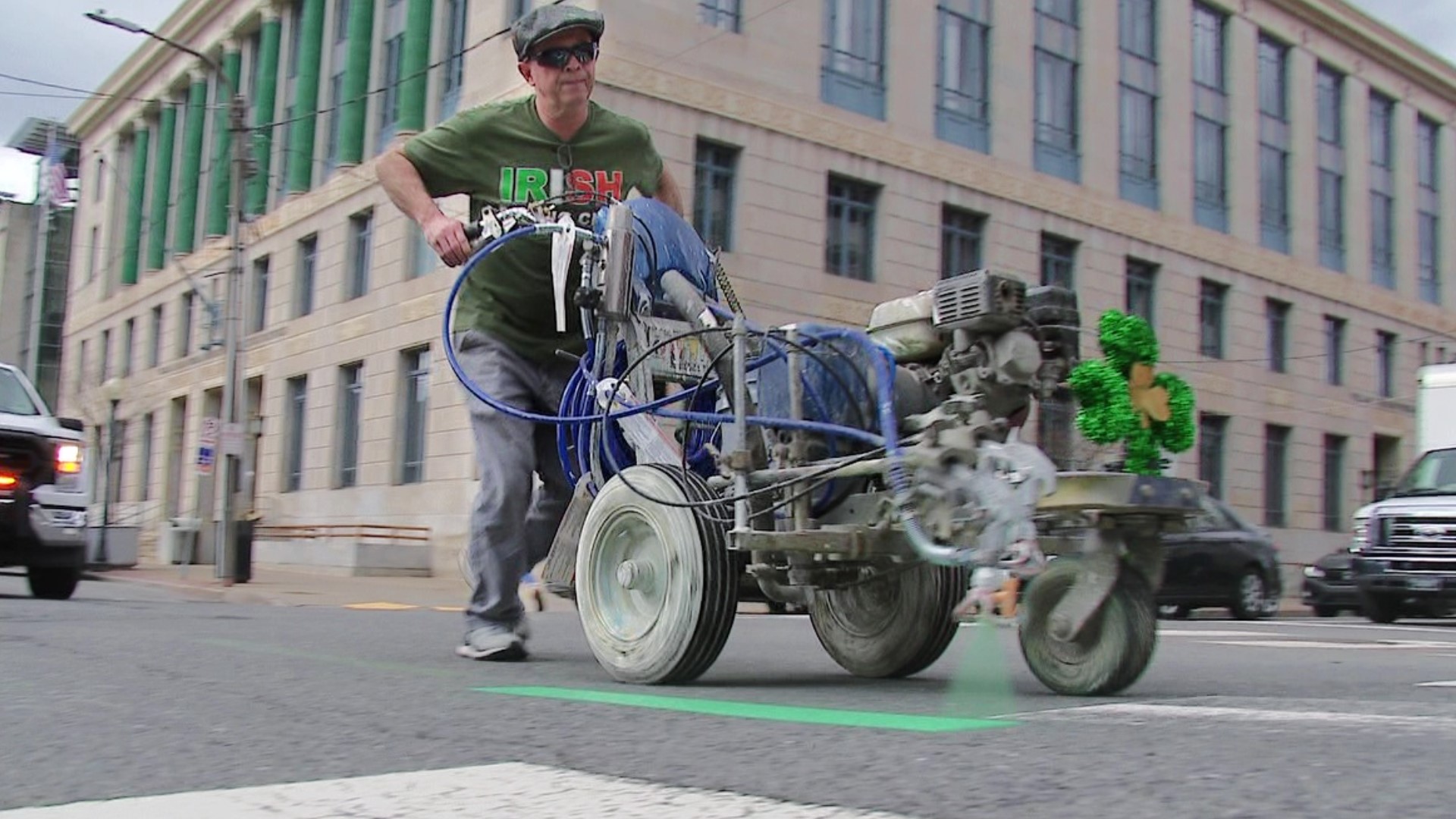 DPW workers painted the city green on Monday ahead of the parade set for Saturday.