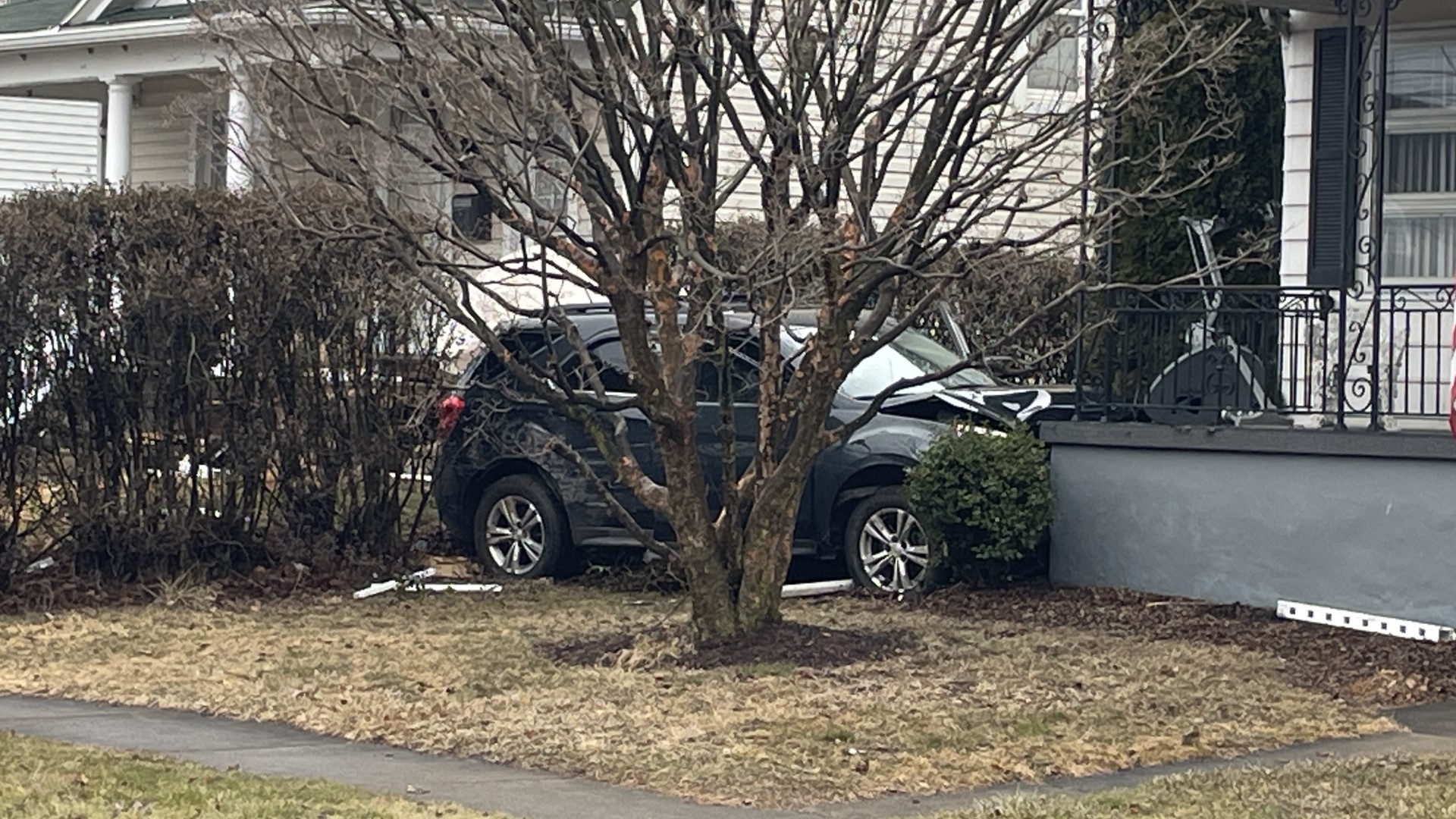 A crash in Lackawanna County Friday morning damaged two houses and sent a driver to the hospital.