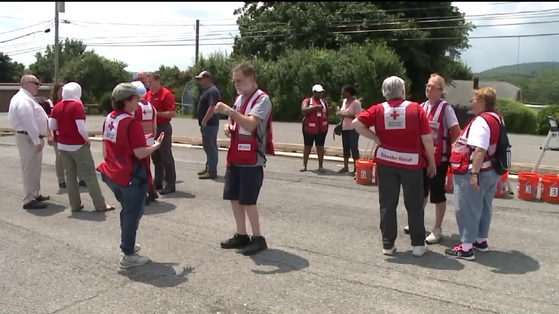 Red Cross Volunteers Pass Out Smoke Alarms Following Fatal Fire