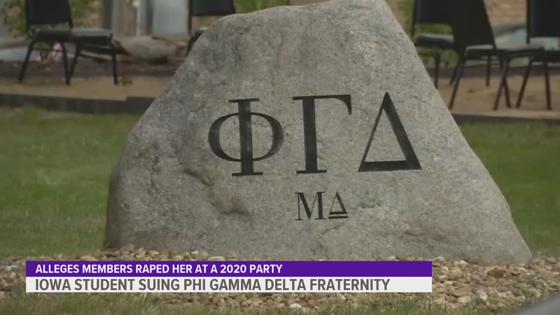 A woman is suing the University of Iowa Phi Gamma Delta fraternity and two men after an alleged sexual assault that spawned protests on campus earlier this fall.