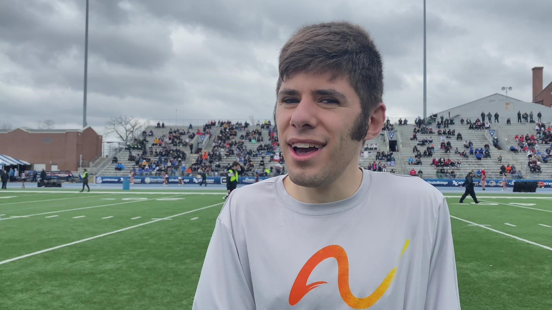 Members of the Pelicans react to big win at the Drake Relays.