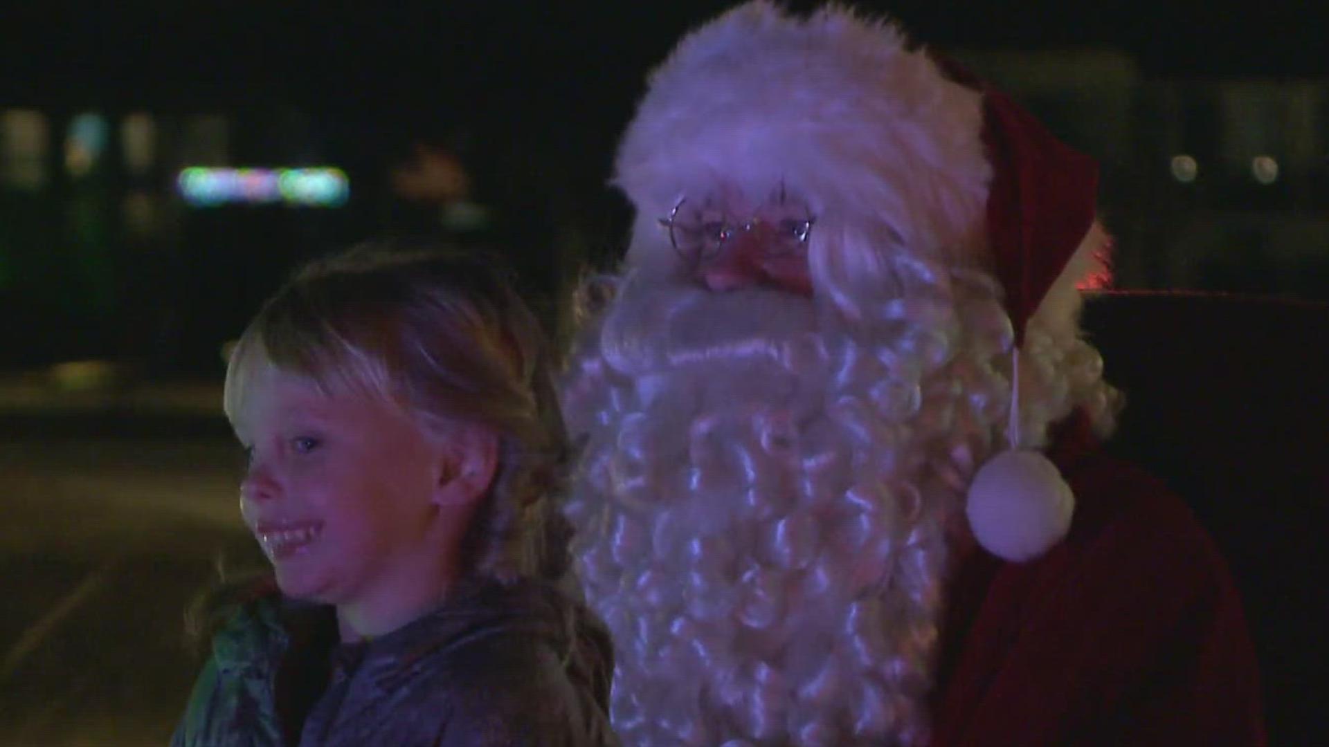 Santa rode through the community on a fire truck.