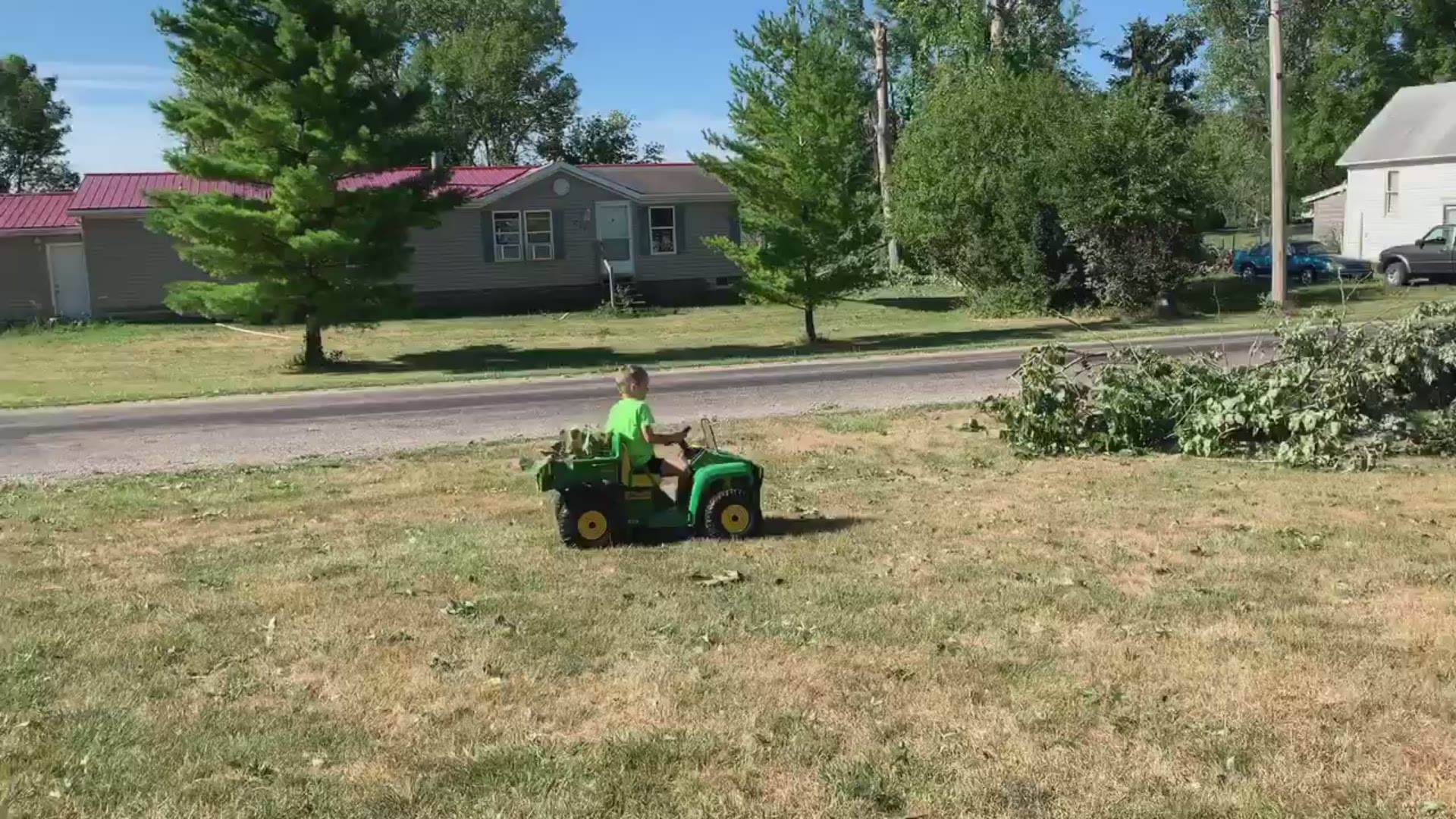 7-year-old boy drives his gator to help clean up storm debris