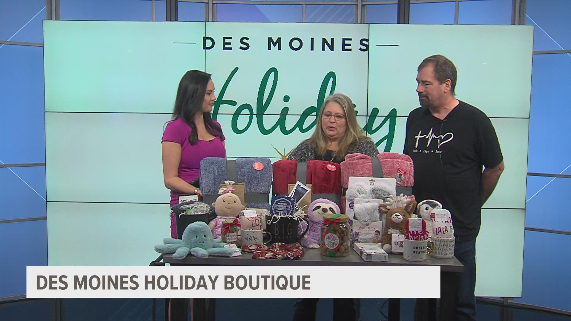 Vendor for Des Moines Holiday Boutique shows off gifts ahead of the
