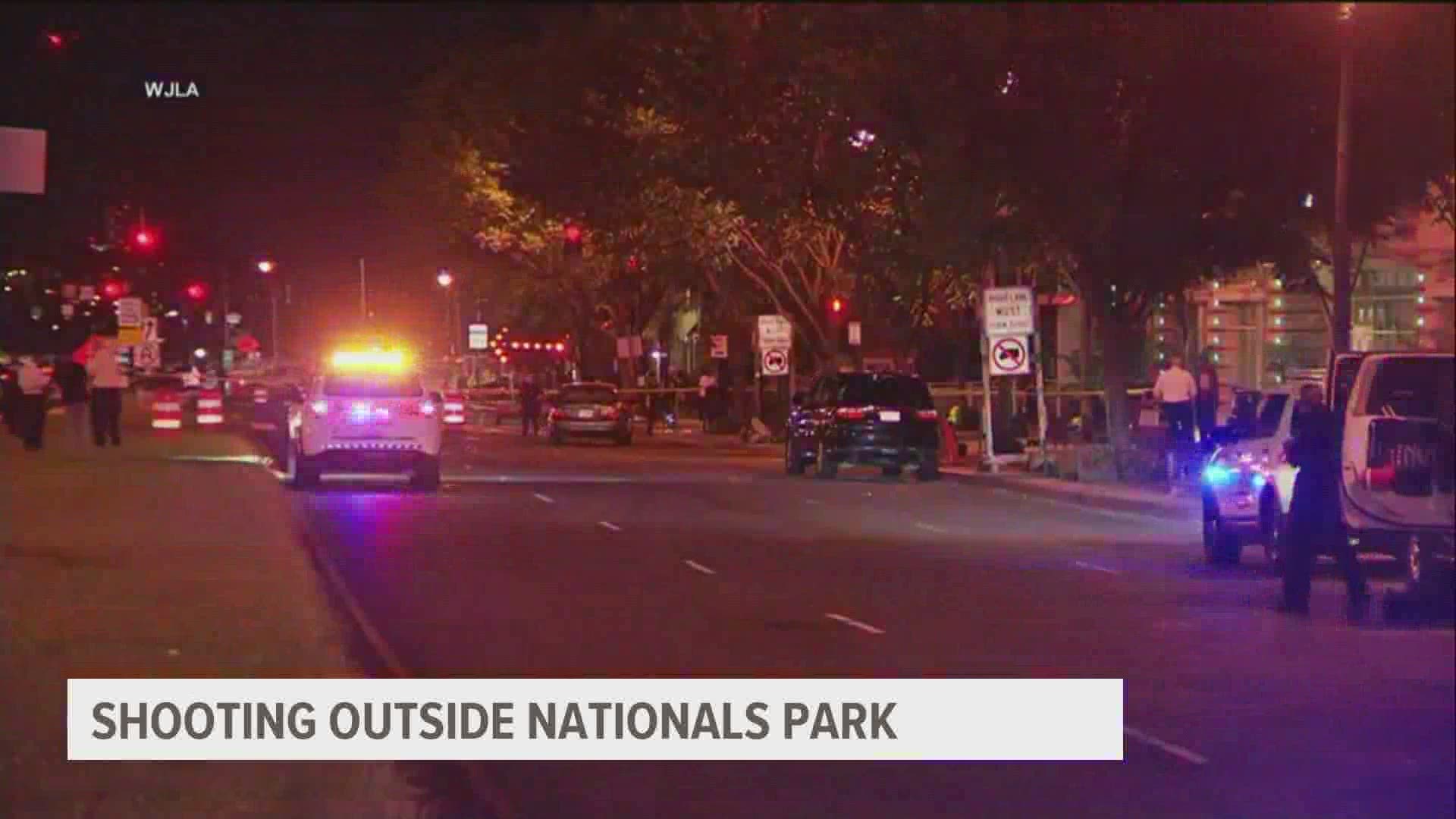 Police said two cars involved in a shootout caused the incident, which also injured a woman who had attended the game and was outside the stadium when she was shot.