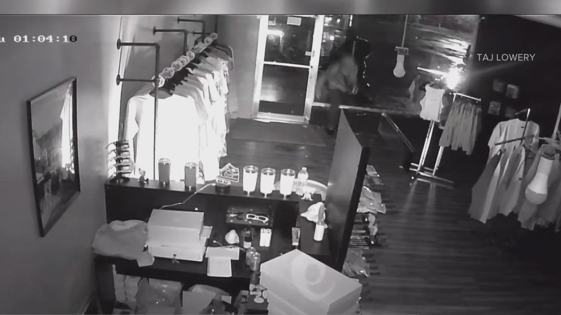 Surveillance video shows a masked intruder breaking the front window, coming into the store and using what looks like a blow torch to light merchandise on fire.