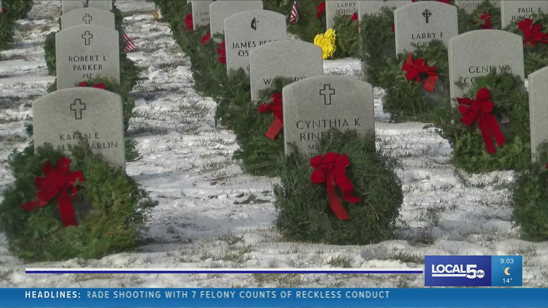 Wreaths Across America volunteers braved the elements to leave a token of their gratitude for the state's veterans.