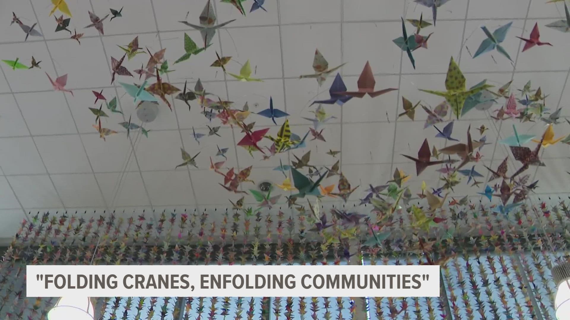 DMACC's Ankeny campus showcases "Folding Cranes, Enfolding Community," an exhibition dedicated to those who've died from the virus.