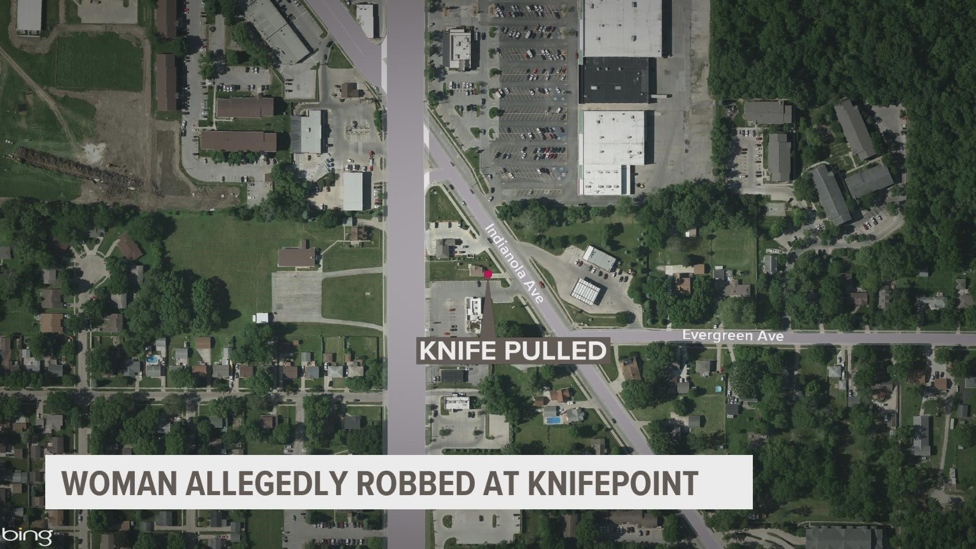 A woman told officers that a man forced her to withdraw cash from an ATM at knifepoint, according to the Des Moines Police Department.