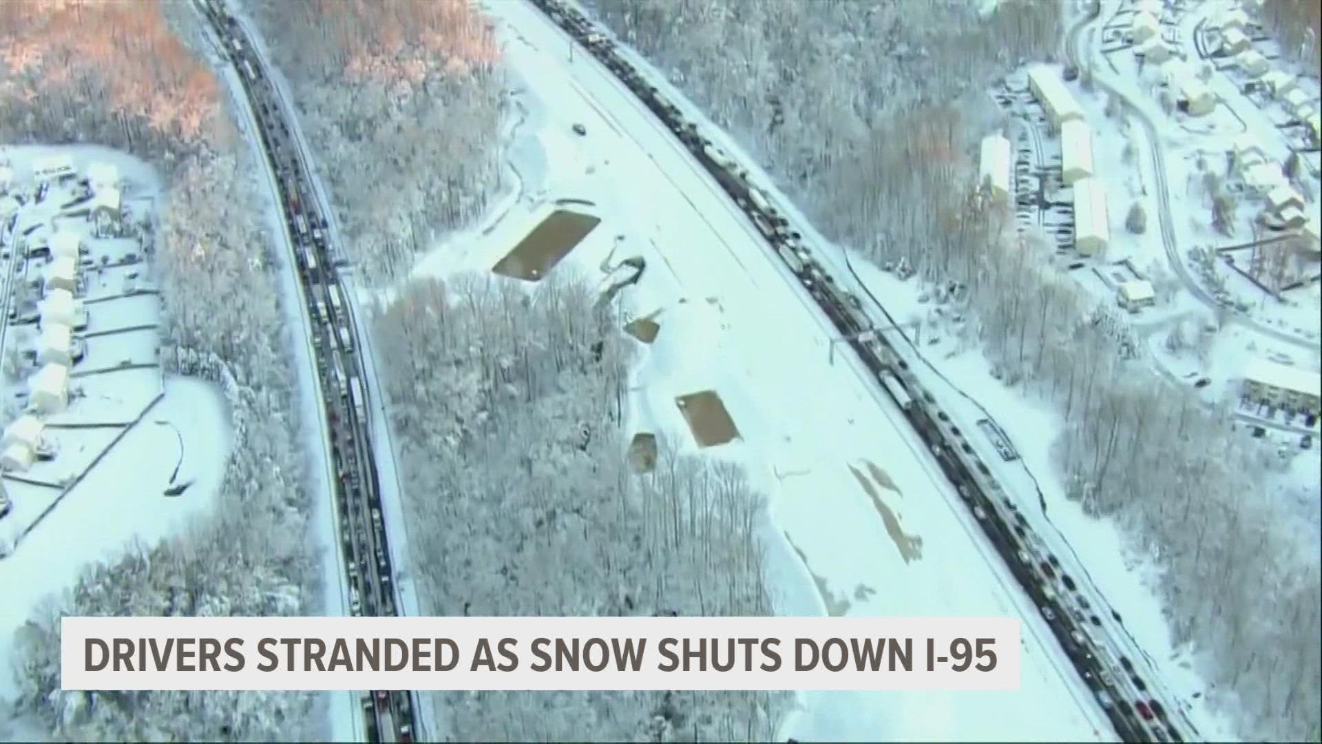 Police say that part of Interstate 95, south of the nation's capital, became impassable Monday when tractor-trailers jackknifed in a winter storm.