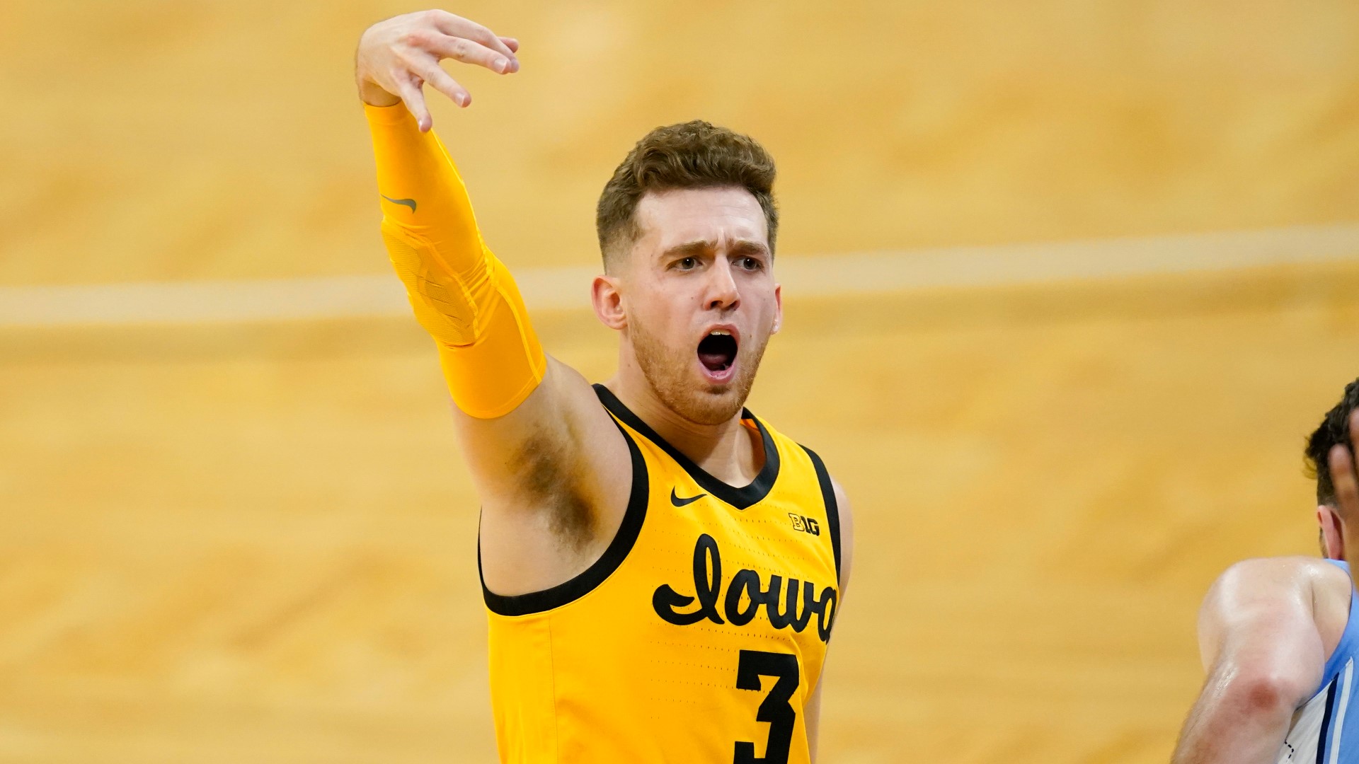Iowa basketball player suspended for a game after being charged in bar  fight