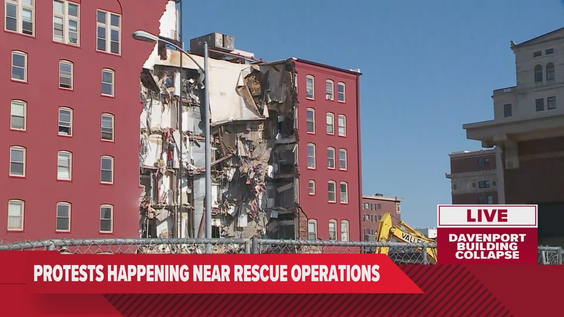 The demolition of the building was delayed after a woman was found alive in the rubble.