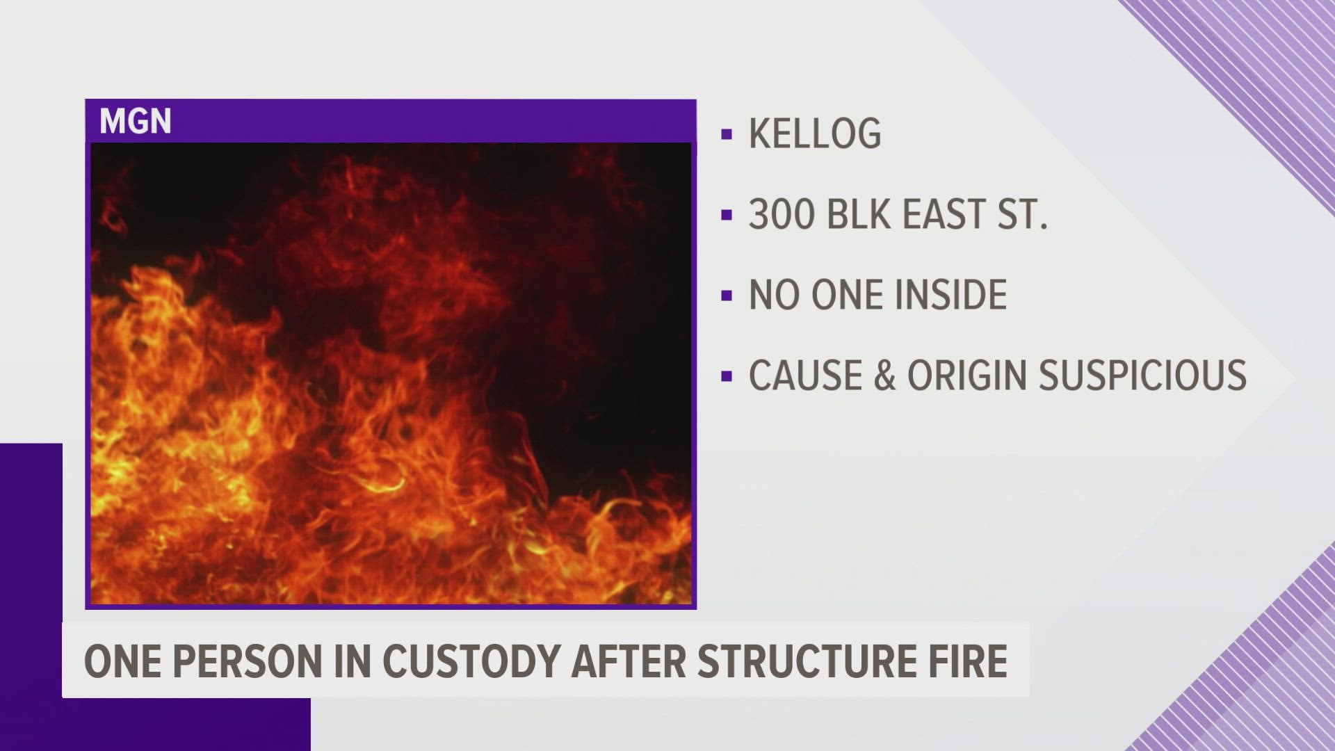 One person has been taken into custody following a fire at a Kellogg residence Wednesday.