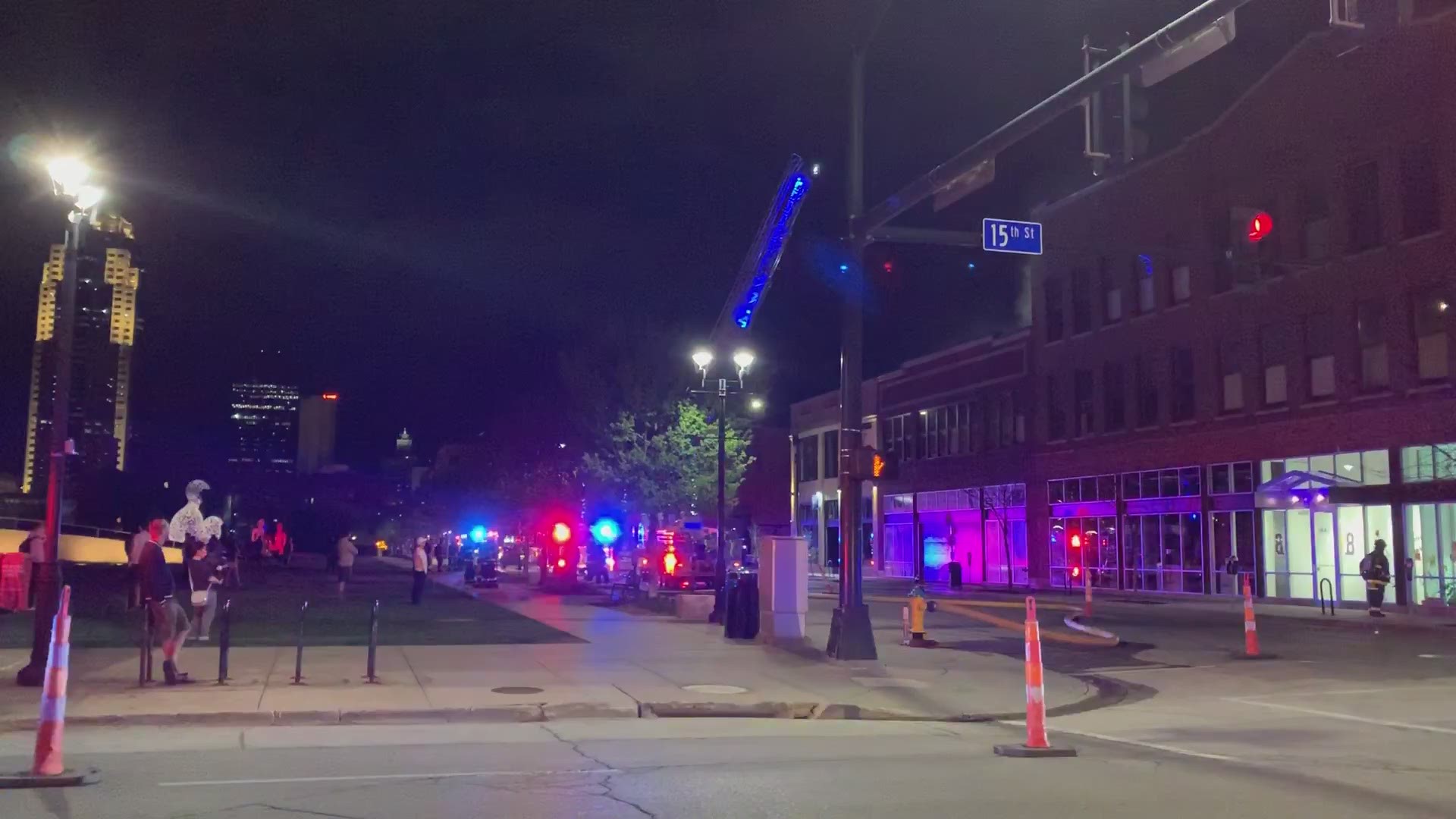 Officials battle rooftop apartment fire in downtown Des Moines Tuesday night.