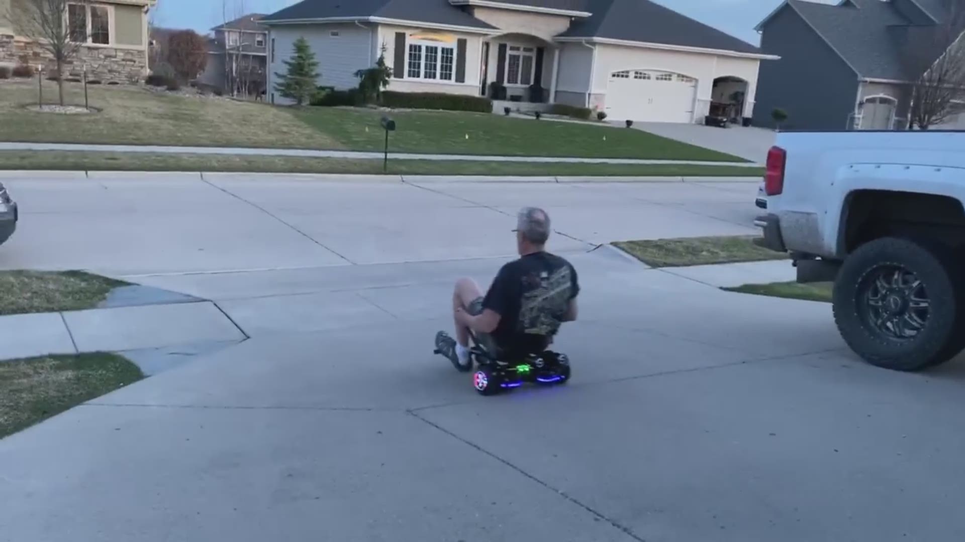 Dad riding motorized scooter takes a tumble