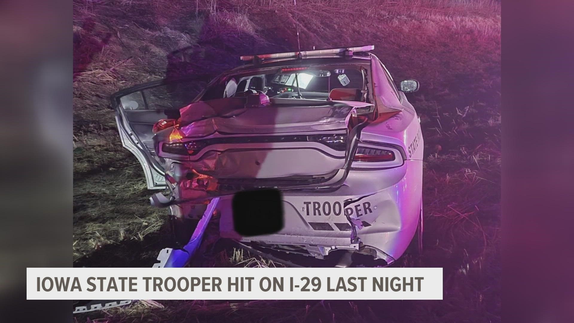 ISP said a trooper and the driver of another car suffered minor injuries, but the passenger of the other car has life-threatening injuries.
