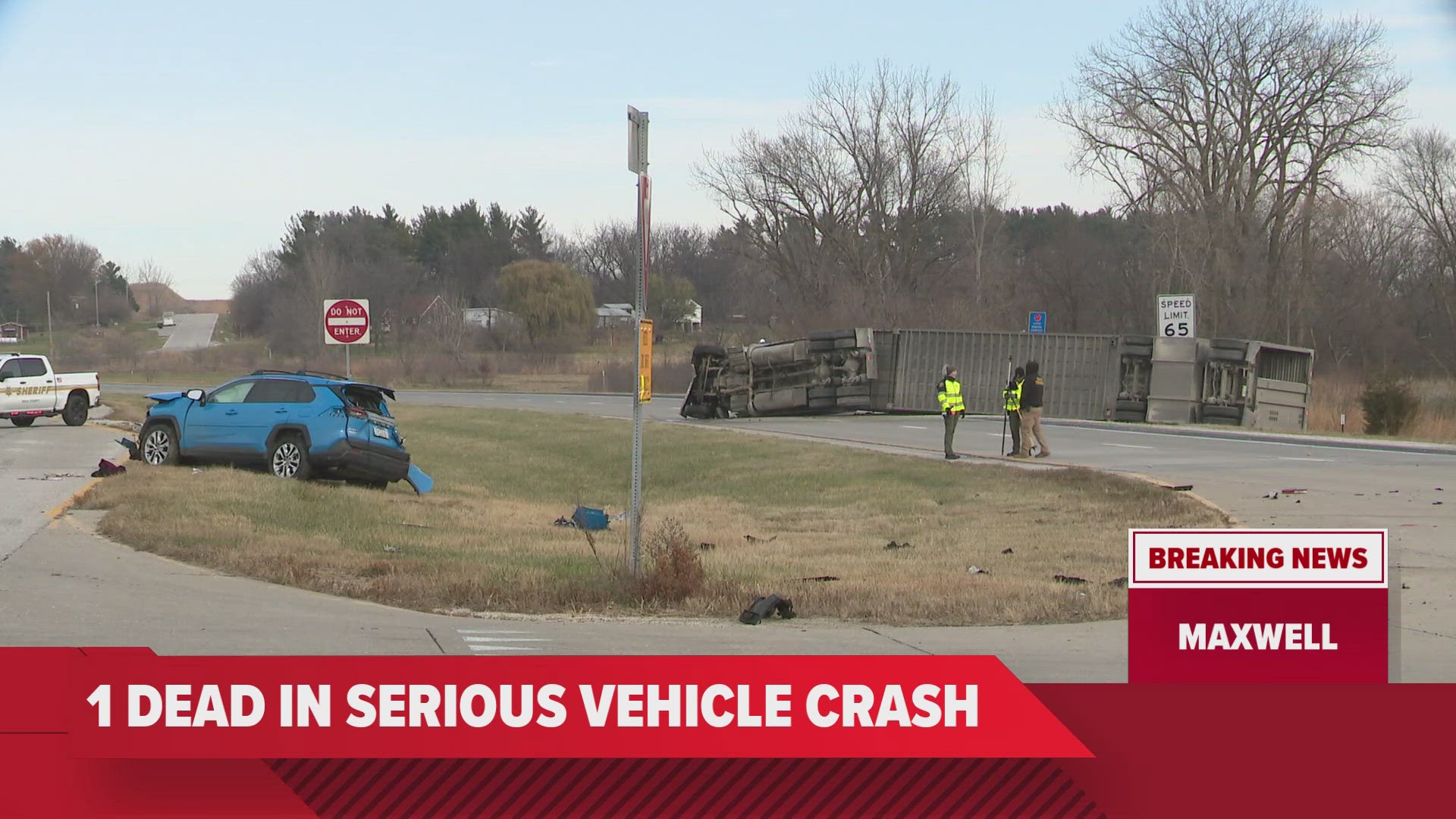 The semi, which was hauling a livestock trailer full of pigs, overturned as a result of the crash.