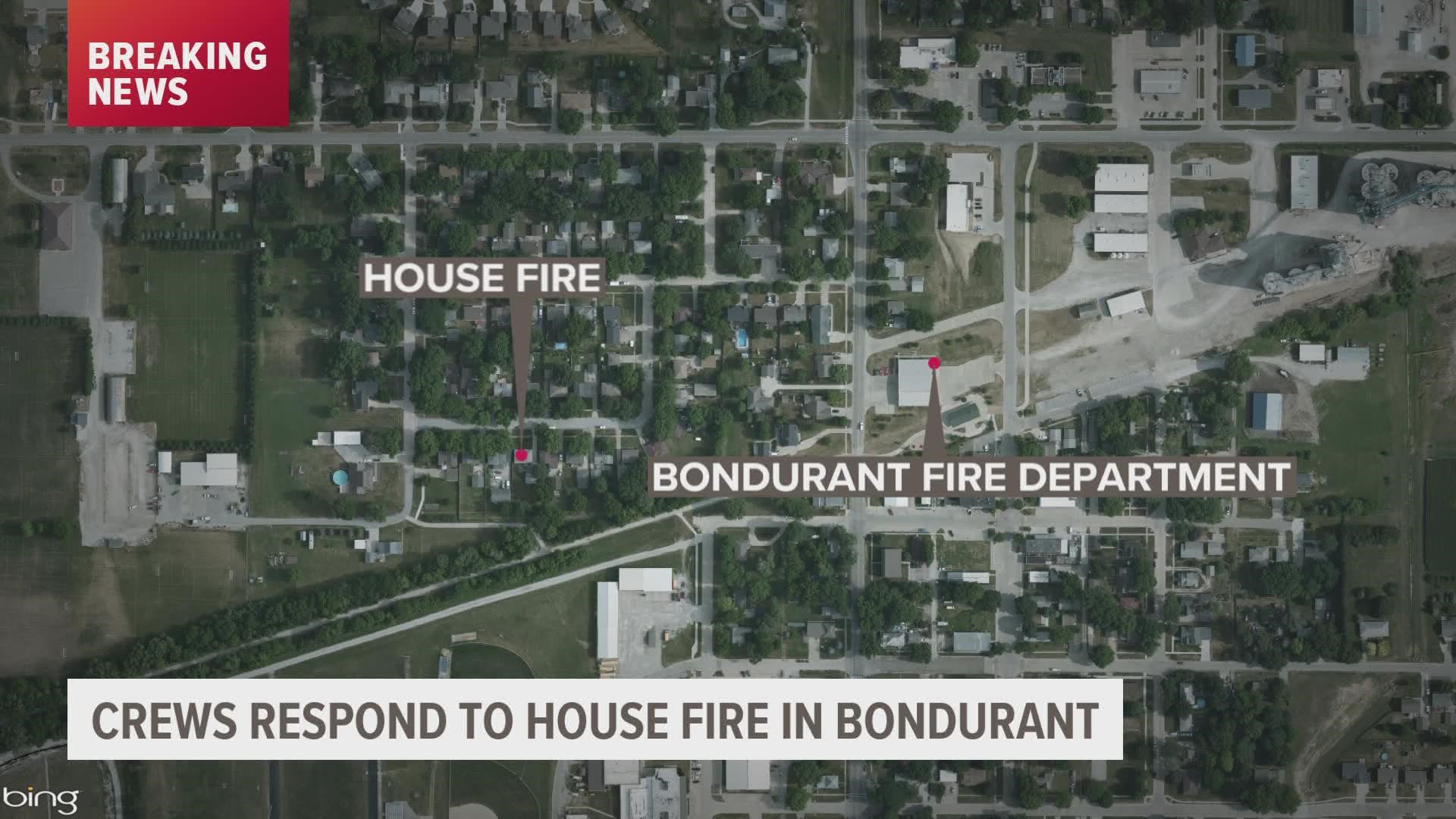 First responders work on house fire in Bondurant