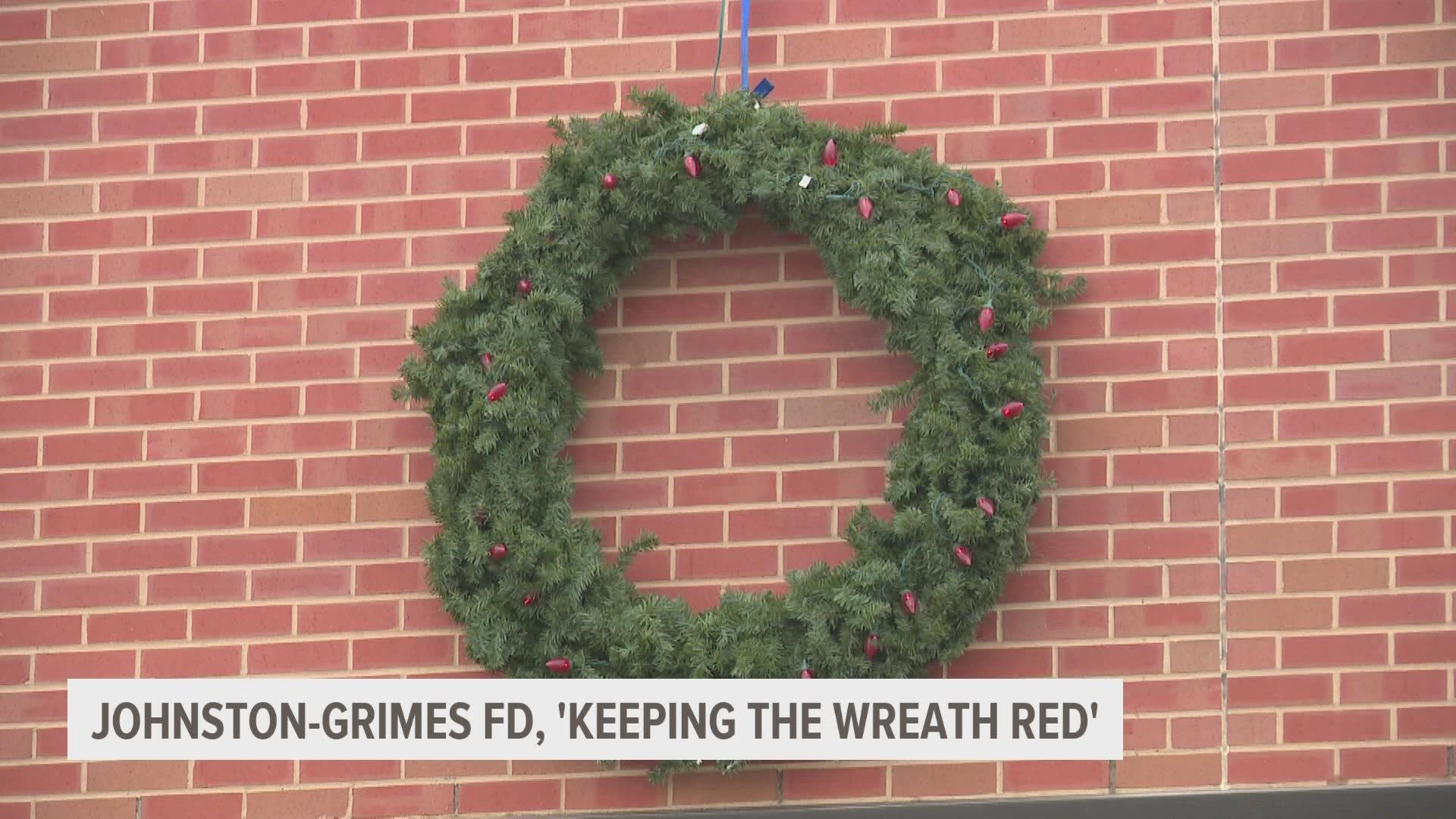 By keeping the wreath red, the fire departments hope to raise awareness for home fires during the holidays due to common festive decorations.