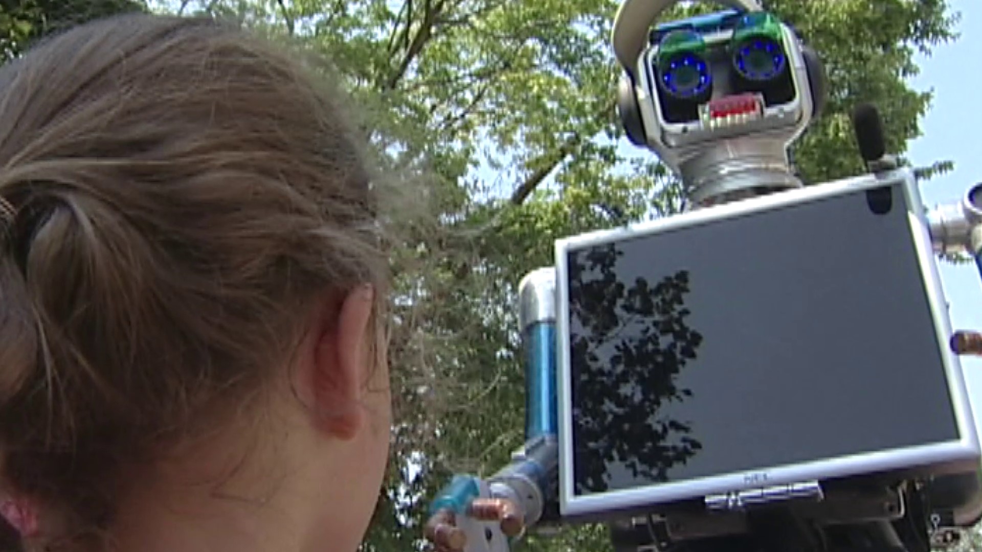 Dozens of people followed a new talking robot, which glided around the fairgrounds stating the temperature and greeting Iowans as they passed by.