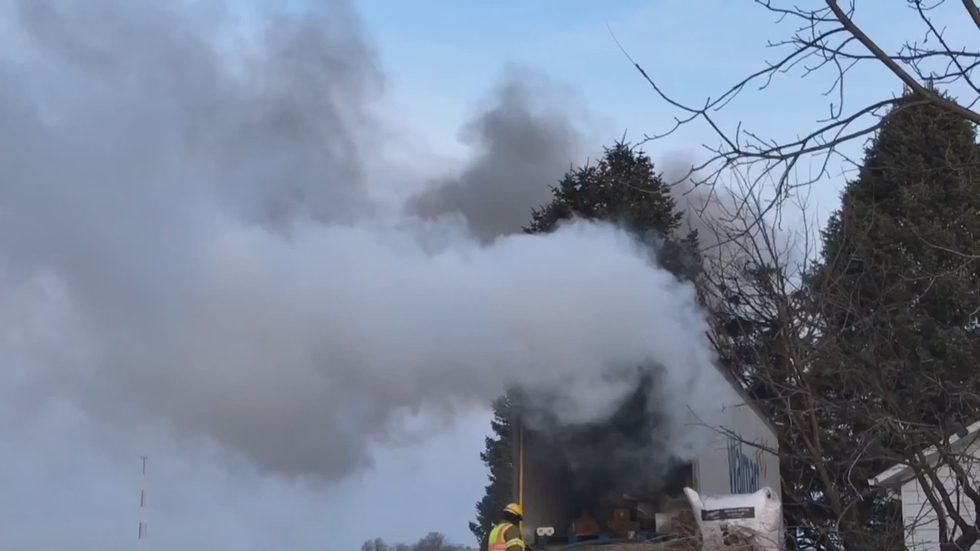 Semi truck narrowly misses home before crashing and bursting into flames Tuesday morning