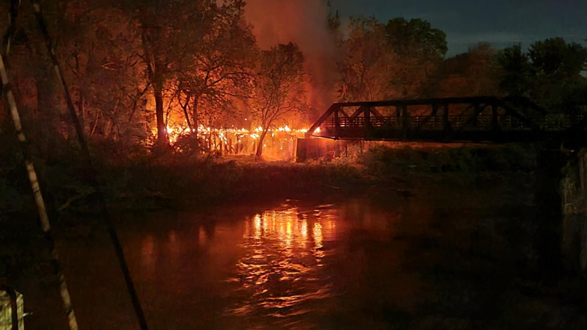 Flames were reported to first responders at the east end of the bridge around 2 a.m. Monday. 