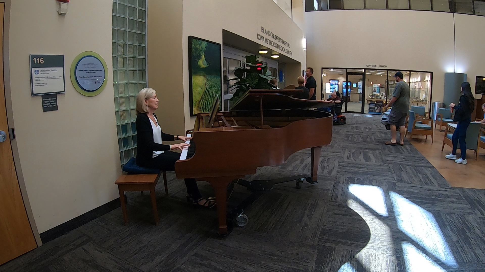 Joan Shultz has volunteered at UnityPoint Health in downtown Des Moines for five years, and said she plays the grand piano to "brighten somebody's day."