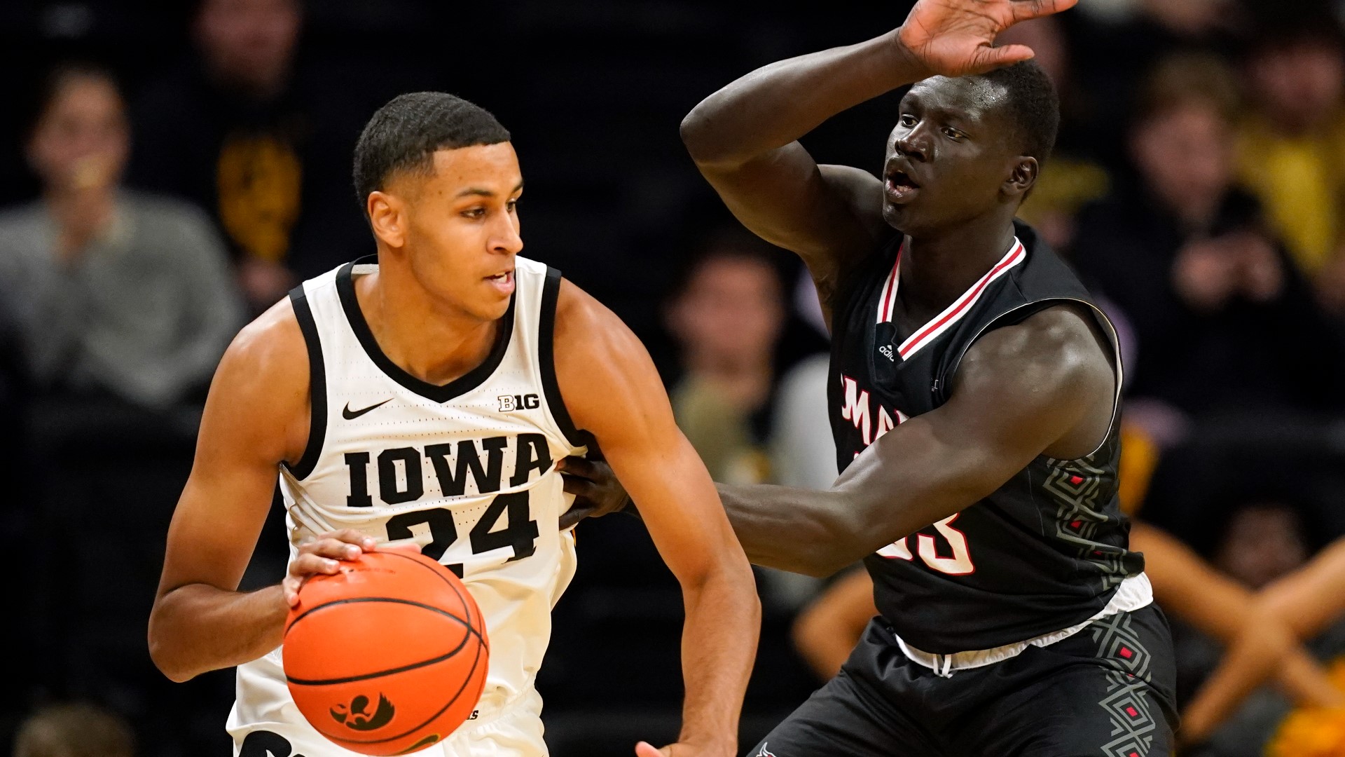 Kris Murray scored a career-high 30 points as Iowa defeated Omaha 100-64 in an Emerald Coast Classic preliminary game.