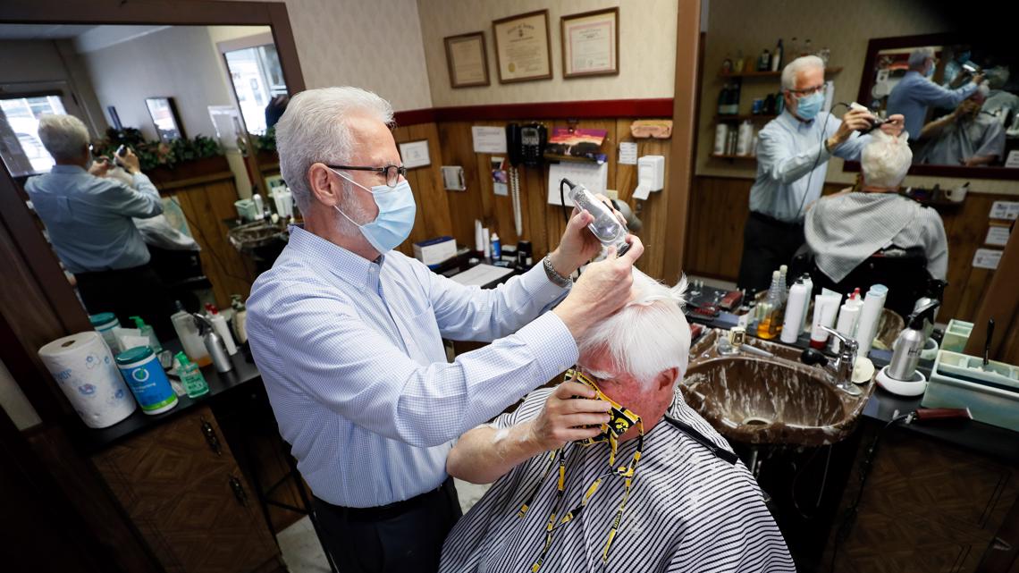 Des Moines barber shop reopens with proper health precautions
