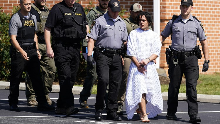 After catching an escaped murderer, officers took a photo with him. Was it inappropriate?