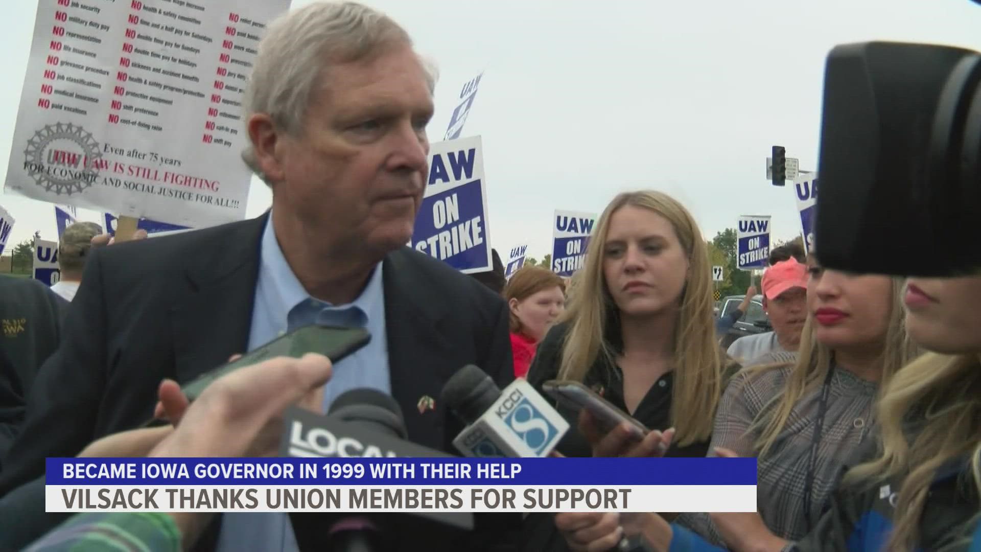 The former Iowa governor told union workers picketing at the Ankeny John Deere plant he wanted to support them like they supported him in his campaign.