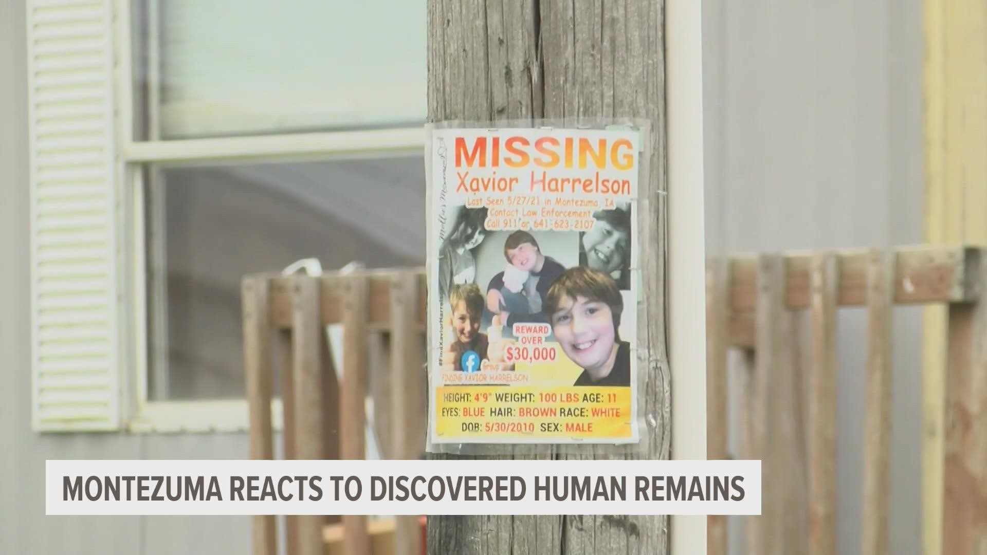The missing person signs showing the boy's smiling face will remain on display until the community receives confirmation on whether or not the remains are his.