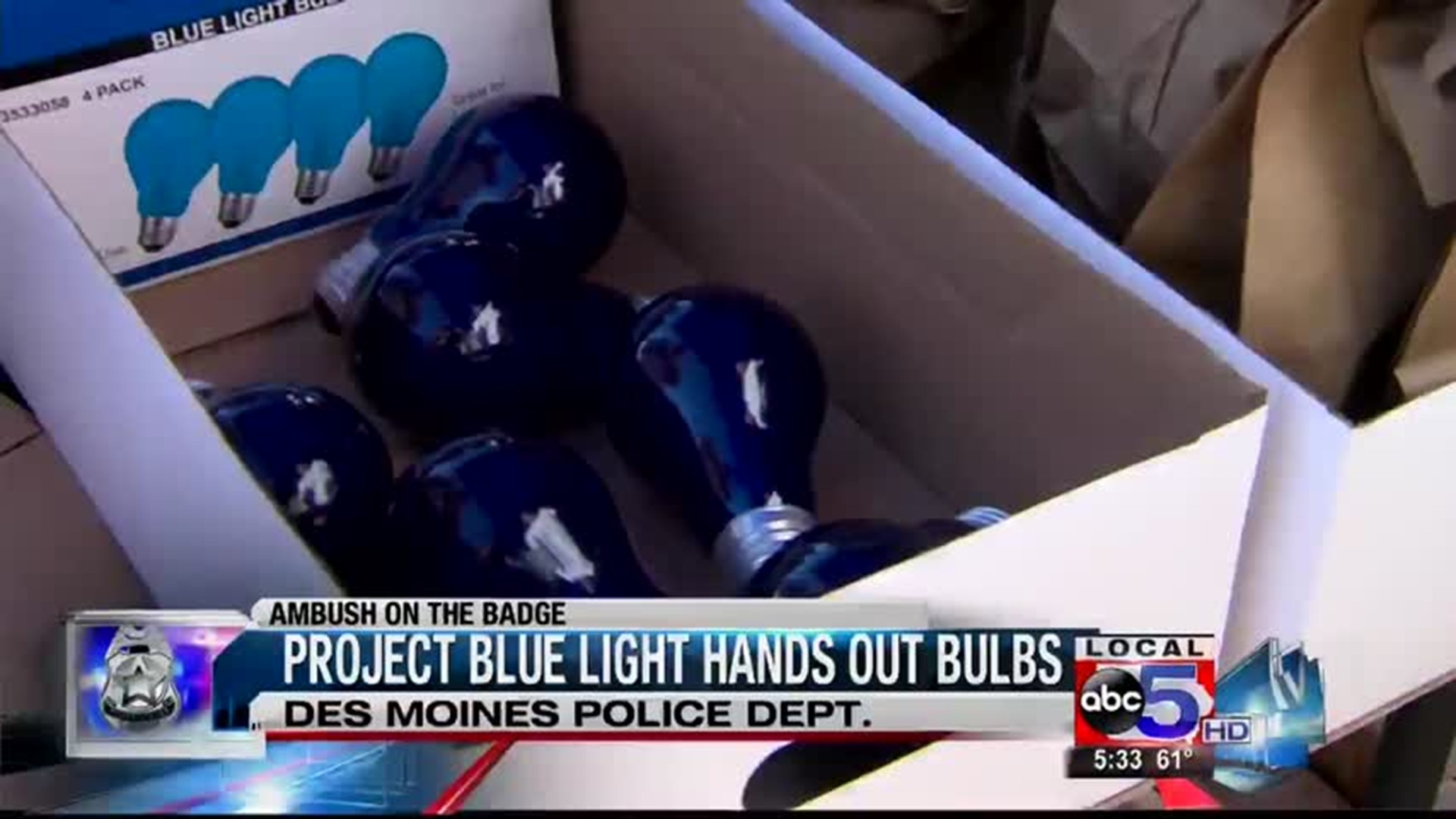 Project Blue Torch Project blue light hands out bulbs | weareiowa.com