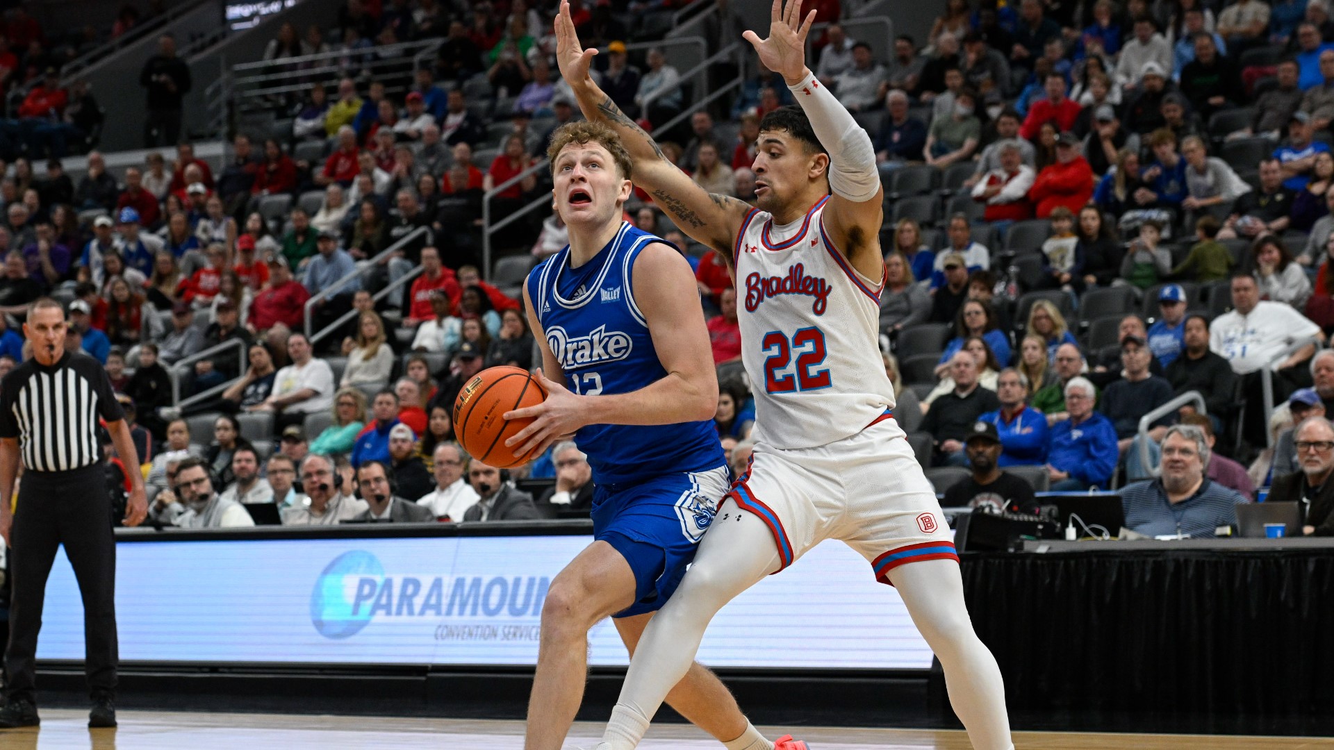 Tucker DeVries scored 22 points and second-seeded Drake raced to its sixth NCAA Tournament berth with a 77-51 romp past top-seeded Bradley on Sunday.