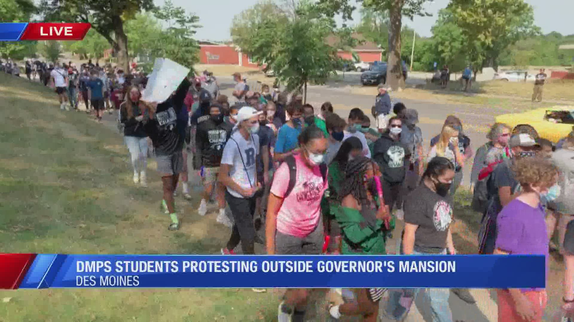 Students from Des Moines and Amesmarch to Gov. Kim Reynolds mansion to protest the state's decision to suspend all sports and in-person activities.