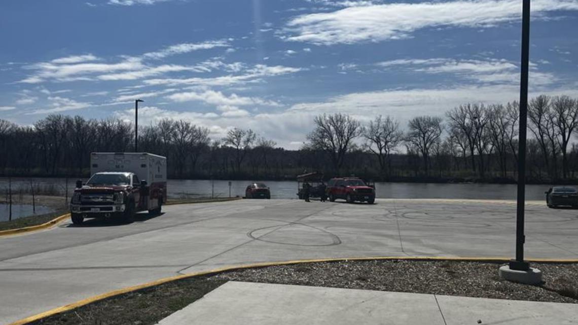 First responders recovering body from the Des Moines River