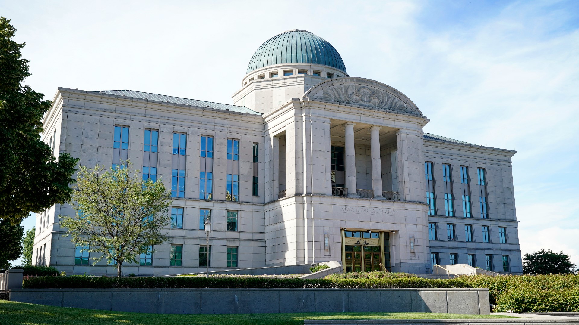 The Iowa Supreme Court's opinion released Friday and written by Justice Edward Mansfield returns a case over the state's 24-hour waiting period to district court.