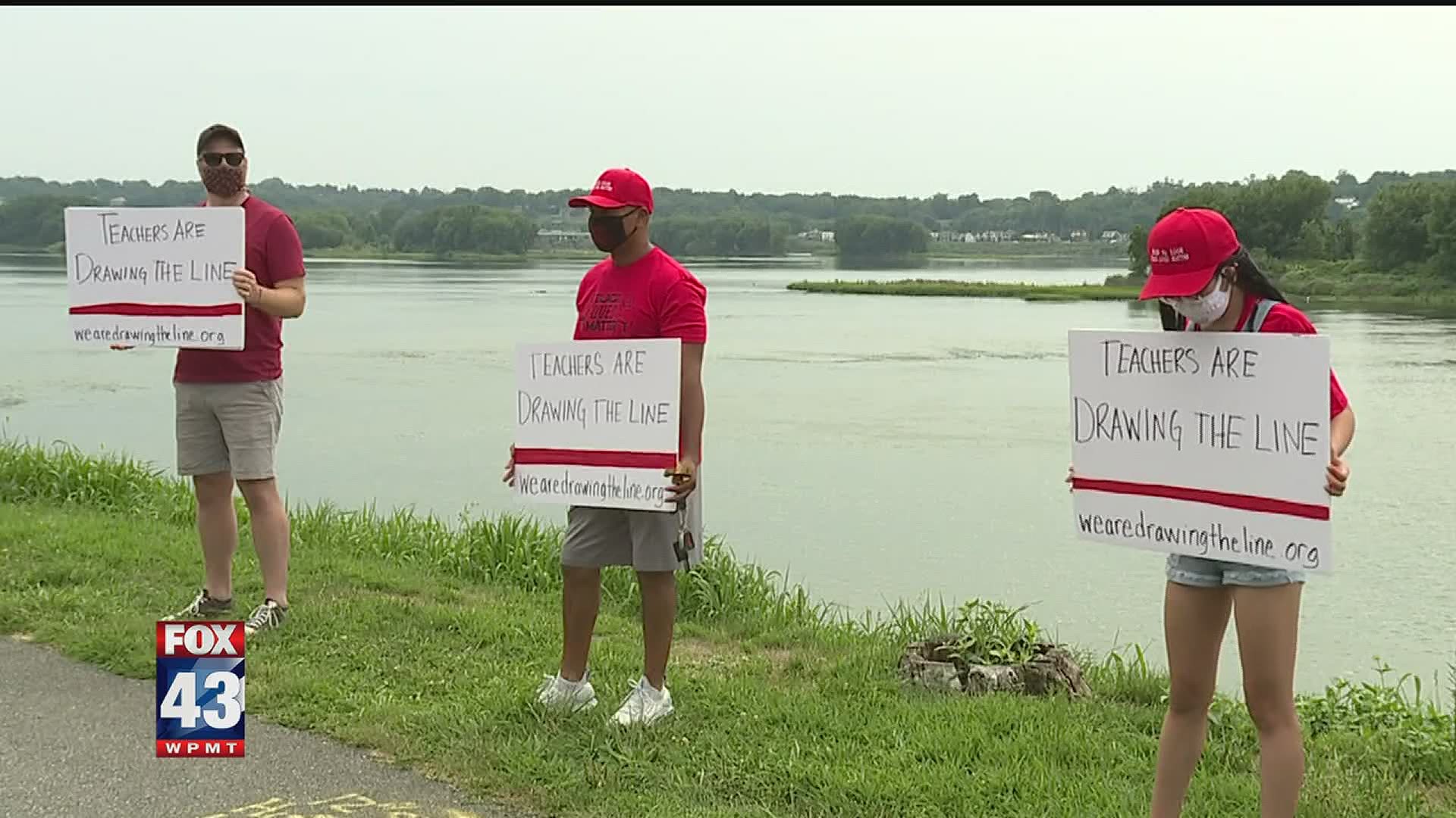 The protest is part of a national campaign called "Drawing the line"