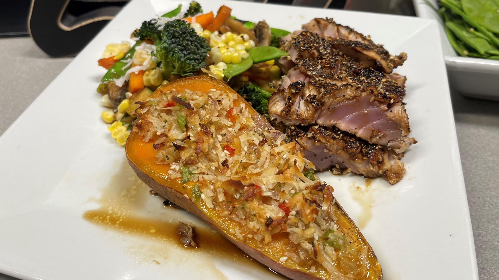 Olivia's sesame seared tuna with roasted sweet potatoes is a light, summery meal that is best enjoyed sitting out on the patio with a citrus peach margarita in hand.