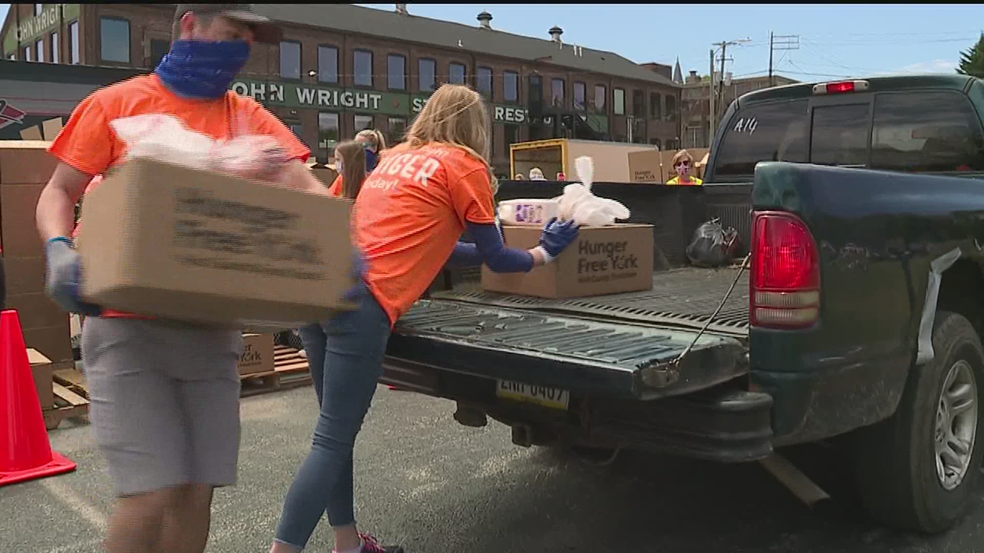 Hundreds of cars lined up at John Wright restaurant to get a food box.